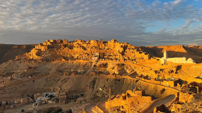 The Berber village of Chenini glowing at sunset in southern Tunisia